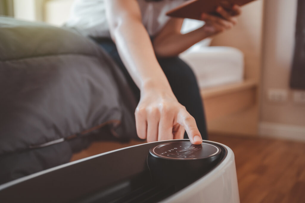 person using an air purifier