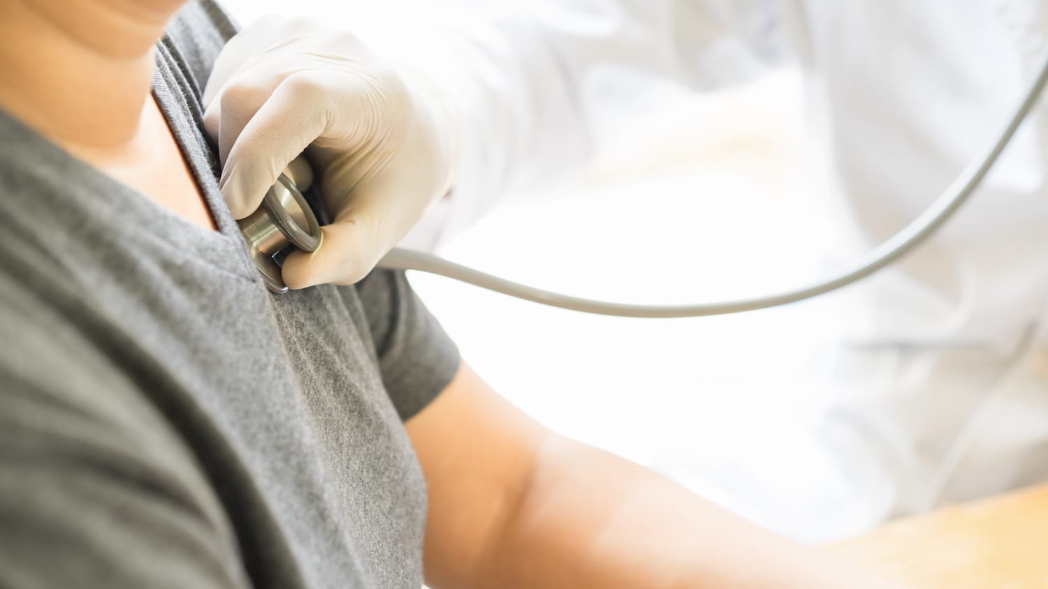 How Sleep Deprivation Affects Your Heart doctor checking heart rate