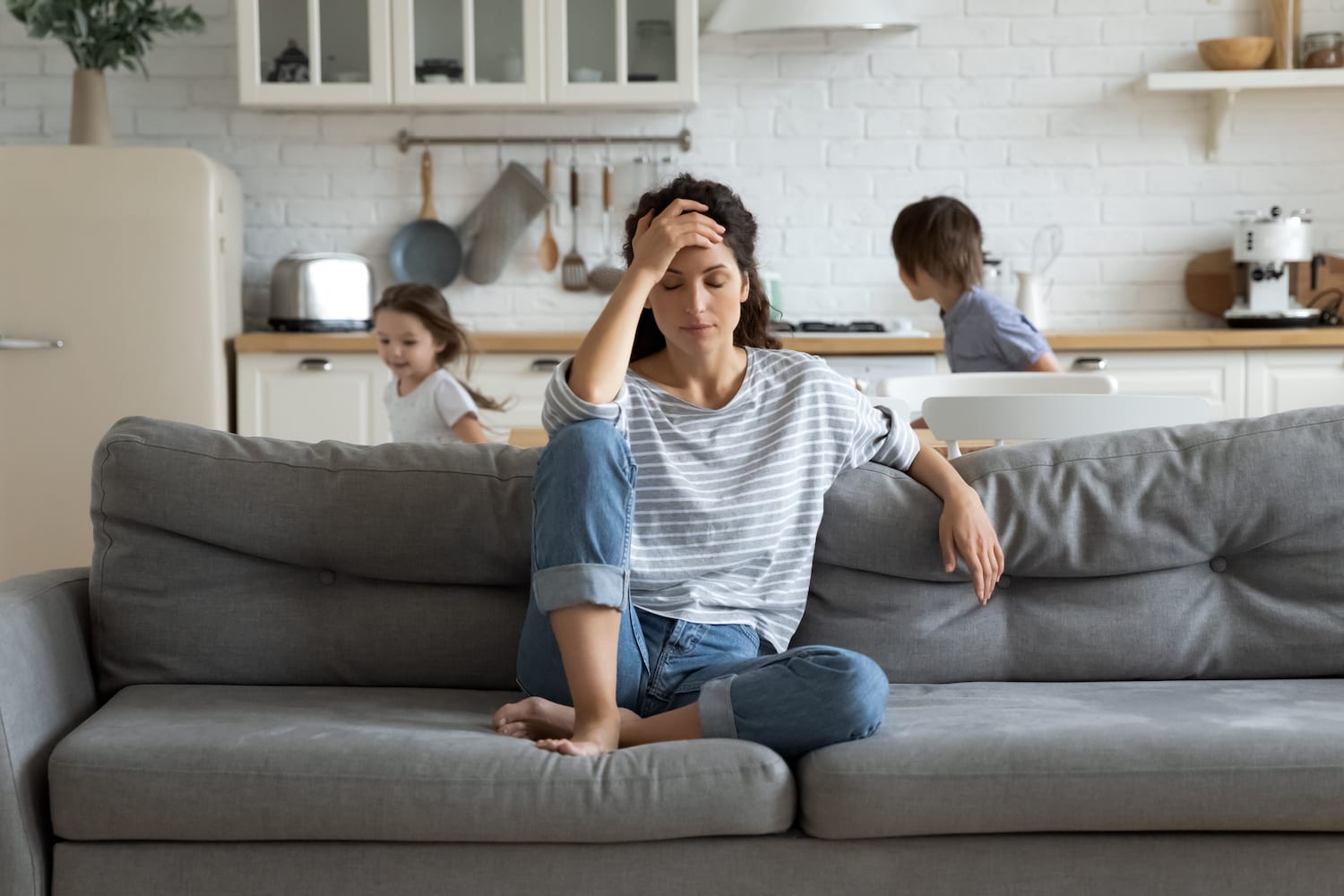 Can a Lack of Sleep Cause Headaches? woman with headache