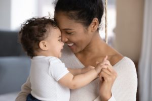 When Can Your Baby Sleep With a Blanket? A baby and mother